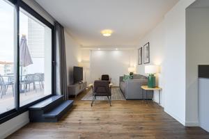 Telewizja i/lub zestaw kina domowego w obiekcie Feelathome Goya Apartments