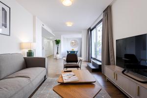 Telewizja i/lub zestaw kina domowego w obiekcie Feelathome Goya Apartments