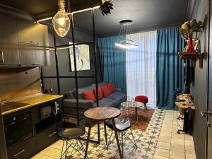 a living room with a couch and a table at New Gudauri Loft 2 Apartment 129 in Gudauri