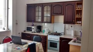 a kitchen with a laptop computer on a table at Villa House Georgia in Tbilisi City