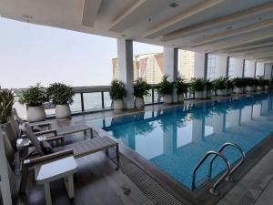 a swimming pool on the roof of a building at City View Studio Unit in Phnom Penh