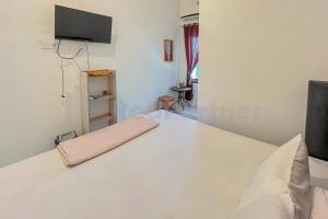 Katil atau katil-katil dalam bilik di Namirah Guesthouse Redpartner