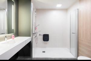 a bathroom with a shower and a sink at Pavillon Tawfik 1 à 4 personnes chez l’habitant in Bagneux +54 photos