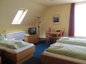 Säng eller sängar i ett rum på Hotel Am Kleinbahnhof