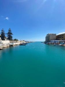 a large body of blue water with buildings and buildings at Beachside Loft/Cosy house/Design in Tunis