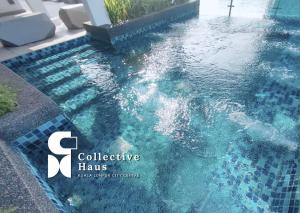 a swimming pool in a house with the logo of collective hairs at Royce Residence Kuala Lumpur by Collective Haus in Kuala Lumpur