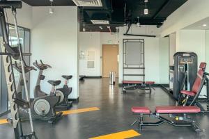 a gym with several exercise equipment in a room at Silk Valley - Furnished 2bhk Close To Metro in Dubai Marina