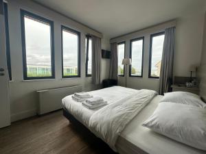 Postel nebo postele na pokoji v ubytování Arriate Hotel