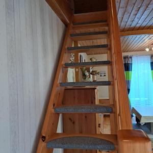 a staircase in a tiny house at Fewo Seepferdchen in Zempin