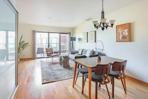 a dining room and living room with a table and chairs at Old Town 1br near dining bars tech hubs PDX-15 in Portland