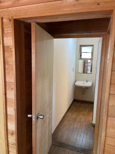 a door leading into a bathroom with a sink at Jomine Koen Campjo - Vacation STAY 85267v in Minano