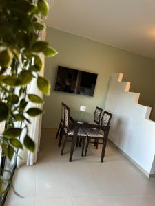 a dining room with a table and chairs at DRYADES in Agios Nikolaos