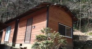 a wooden house with windows on the side of it at Toukaen campsite - Vacation STAY 23959v in Uenohara