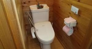 a small bathroom with a toilet and a sink at Toukaen campsite - Vacation STAY 23960v in Uenohara