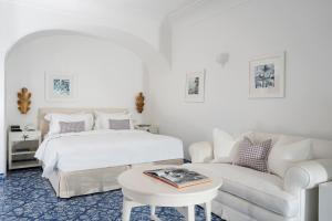 A bed or beds in a room at Hotel La Minerva
