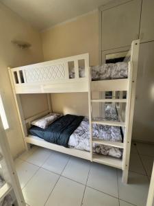 a bedroom with two bunk beds in a room at Ramble Stay Hostel in Dubai