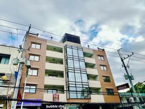 a building with glass windows on the side of it at OYO 1045 Rayjan Apartelle in Manila