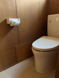 a bathroom with a toilet and a roll of toilet paper at Jomine Koen Campjo - Vacation STAY 85265v in Minano