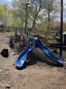 a playground with a blue slide at a park at Jomine Koen Campjo - Vacation STAY 85265v in Minano
