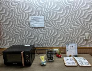 Fulong Hotel tesisinde bir televizyon ve/veya eğlence merkezi
