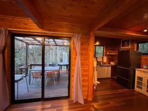 a kitchen and dining room with a sliding glass door at NAKADAKI ART VILLAGE - Vacation STAY 23991v in Shiigi