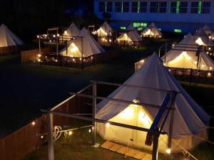 a group of tents with lights in the night at GRAN BLUE - Vacation STAY 46768v in Hongō