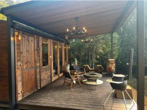 a wooden deck with awning and a table and chairs at Re Come Across Doglamping - Vacation STAY 42085v 