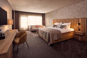 Postel nebo postele na pokoji v ubytování Van der Valk Hotel Groningen Zuidbroek