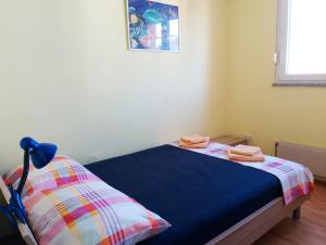 a bedroom with a bed with two towels on it at Rise and shine! in Pula