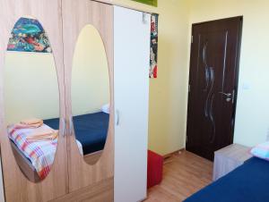 a room with a mirror and a bed in it at Rise and shine! in Pula