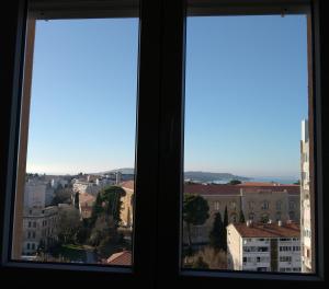 a view of a city from a window at Rise and shine! in Pula +11 photos