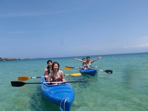 a group of women in kayaks in the water at Grand Beach - Vacation STAY 23981v in Iki