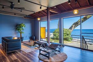 a living room with a view of the ocean at La-gum - Vacation STAY 42360v in Inatori