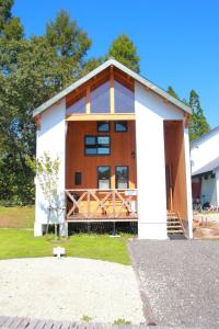 a house with a white and brown at Hirugano Kogen Cottage Park Shikinosato - Vacation STAY 23984v in Shōgahora