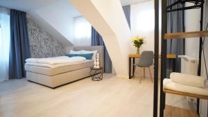 Postel nebo postele na pokoji v ubytování Hotel Böke Lörrach
