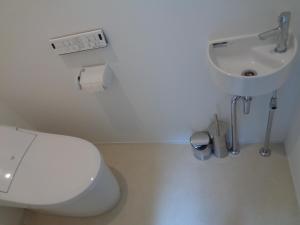 a bathroom with a toilet and a sink at SENKO TINY CAMP - Vacation STAY 85298v in Ueda