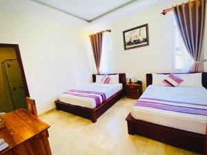 Voodi või voodid majutusasutuse Hoang Quan Hotel toas
