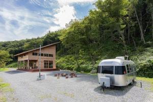 a trailer parked in front of a building at Private resort Hibiki no Yado & Mori - Vacation STAY 85306v in Sato-moriya