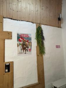 a sign on a wall with a poster on it at Annecy Sainte Claire proche Gare-Lac Duplex 4e étage pour 4ou6 personnes climatisation in Annecy