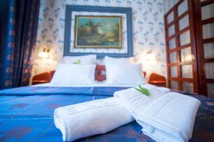 Postel nebo postele na pokoji v ubytování Bucharest Comfort Suites Hotel