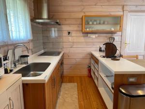 a kitchen with a sink and a counter top at Camp inn Kiyosato GRANDEUR - Vacation STAY 42082v in Hokuto