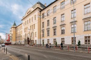 a large building on the side of a street at SKAU 1 Old Town Family & Business Apartment 1floor Free parking in Bratislava