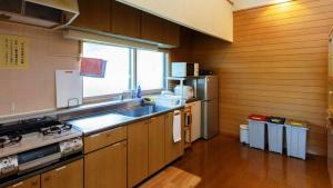 a kitchen with a sink and a counter top at Kabato County - Camp - Vacation STAY 42183v in Shintotsukawa