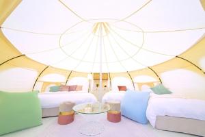a room with two beds in a large tent at Kanonji City - Camp - Vacation STAY 42258v in Kanonji
