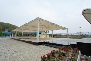 a large white pavilion with flowers in a courtyard at RaDiant Club & Resort in Imphal