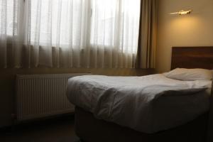 Кровать или кровати в номере Center Room Otel