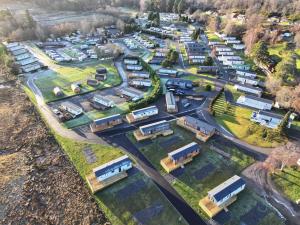 an aerial view of a village with buses at The Drey in Grantown on Spey