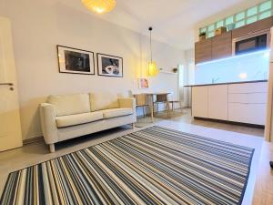 a living room with a couch and a table at Santa Cruz Ocean Apartment - II in Santa Cruz