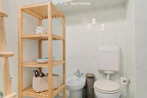 a bathroom with a toilet and a sink at Basilico e Papaja, Terre Marine in Monterosso al Mare +6 photos