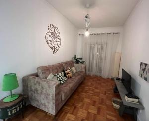 a living room with a couch and a table at Garden 63 - Jardim da Parada - Campo de Ourique in Lisbon